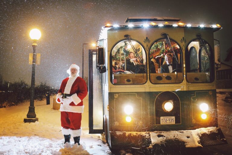 Santa Claus standing next to Trolley